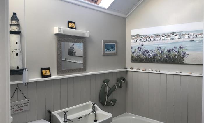 This is the bathroom in the cottage, you also have a small shower bathroom .